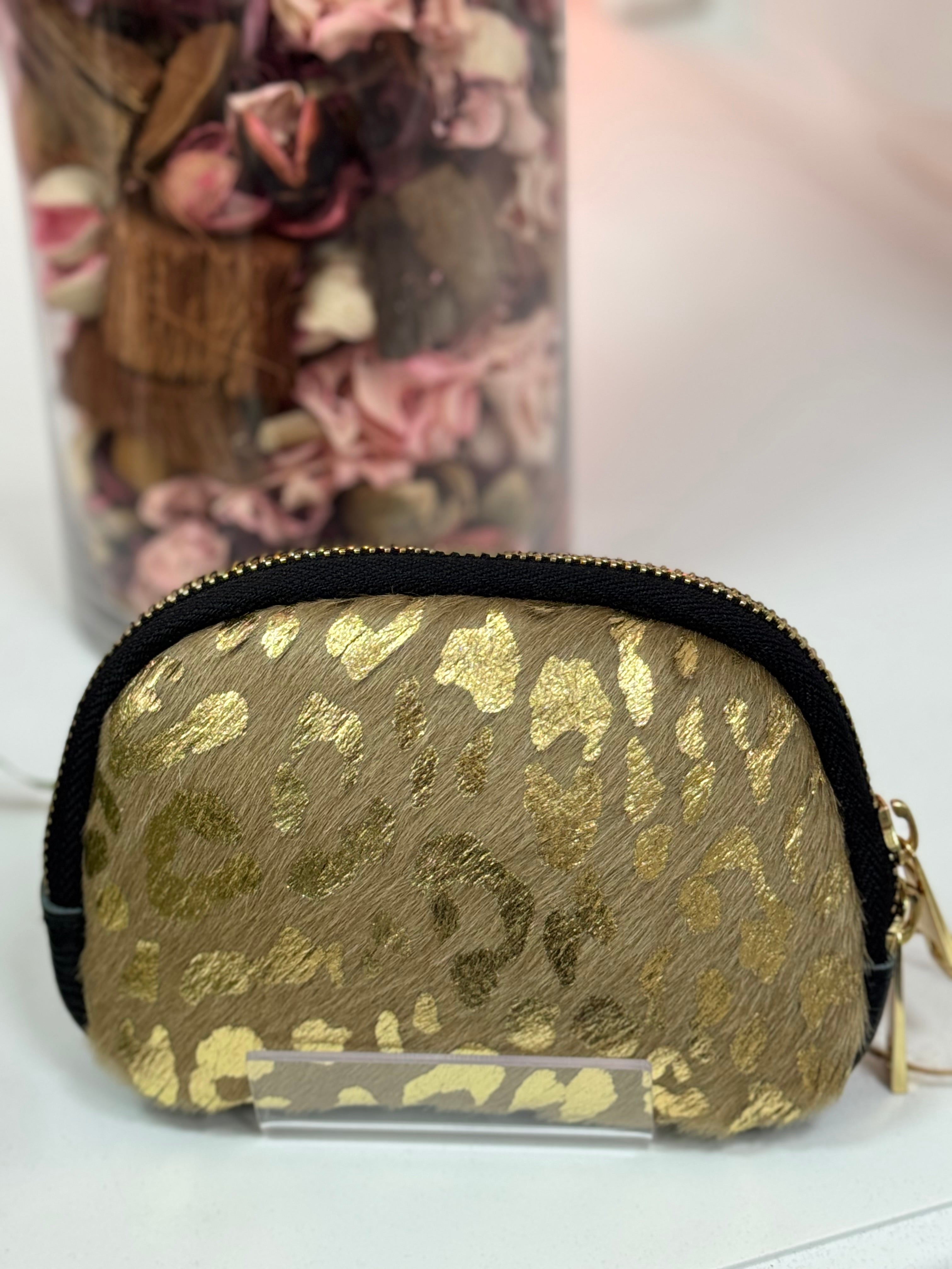 MONEDEROS DE PIEL OVALADOS PELO