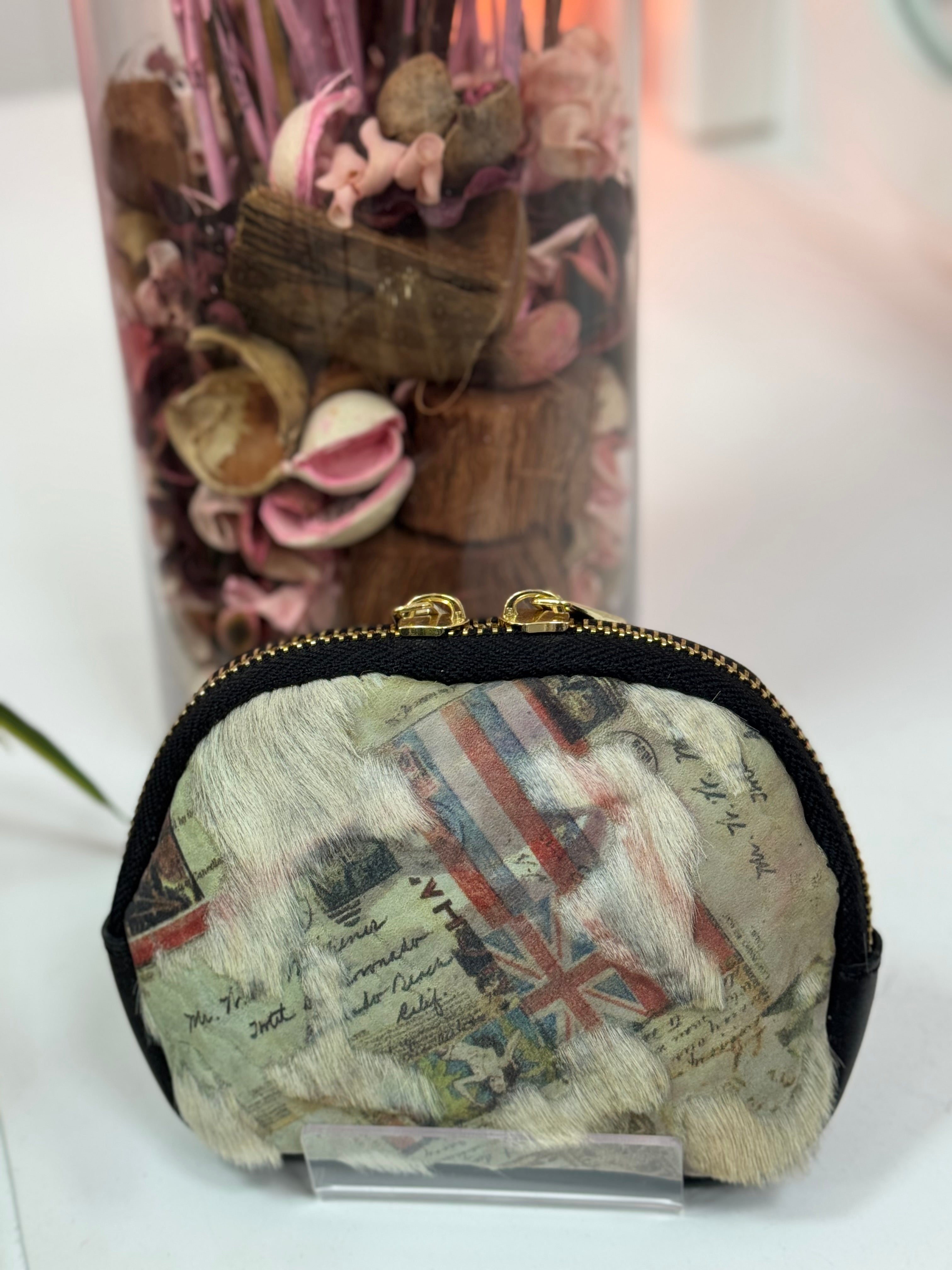 MONEDEROS DE PIEL OVALADOS PELO