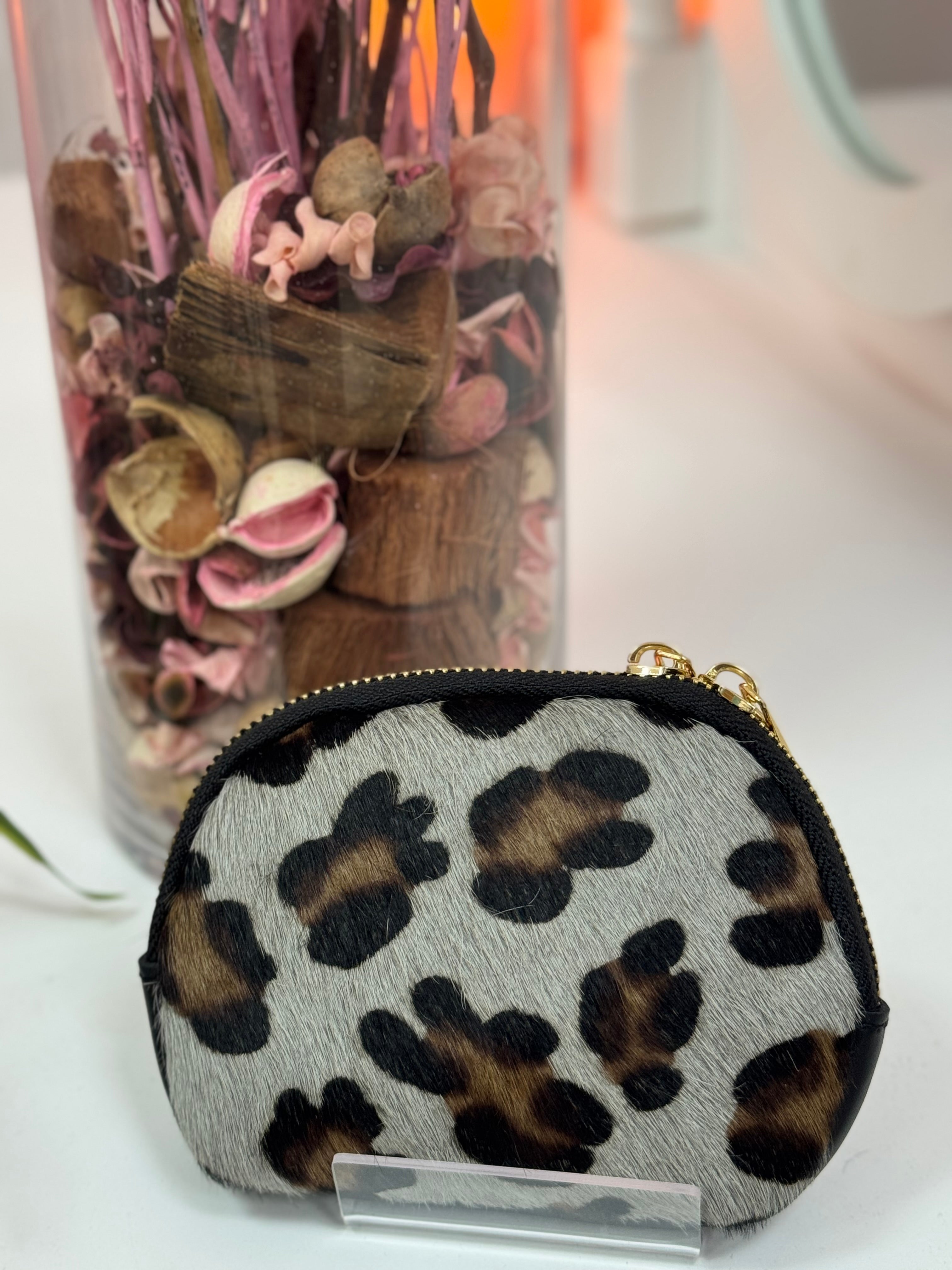 MONEDEROS DE PIEL OVALADOS PELO